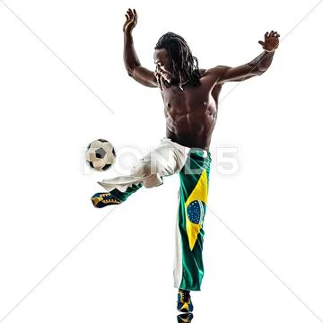Brazilian black man soccer player juggling football Stock Photos