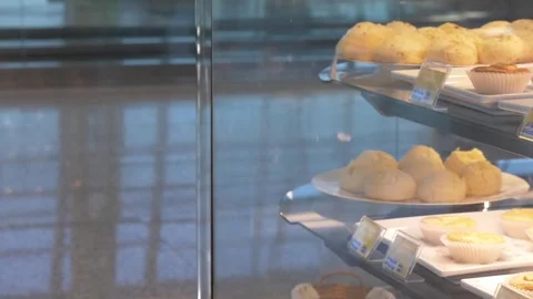 Brazilian cheese bread are displayed at an airport terminal Stock Footage 303664649