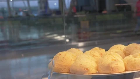 Brazilian cheese bread are displayed at an airport terminal Stock Footage 303664660