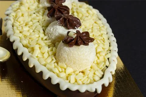 Brazilian easter egg stuffed with white granulated chocolate and cream, taste Stock Photos
