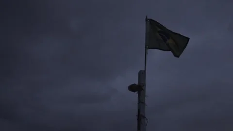 Brazilian Flag and Navigation Light on a Boat Mast at Dawn Over Paraty Bay Stock Footage 320634941
