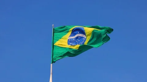 Brazilian Flag in the Blue Sky Stock Footage