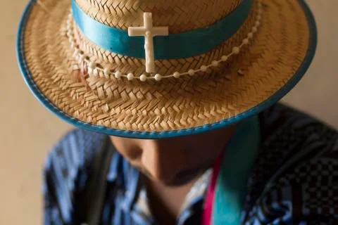 Brazilian man wearing straw hat with Holy Cross and Rosary around Stock Photos