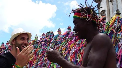 Brazilian Man Welcoming the Tourist giving some