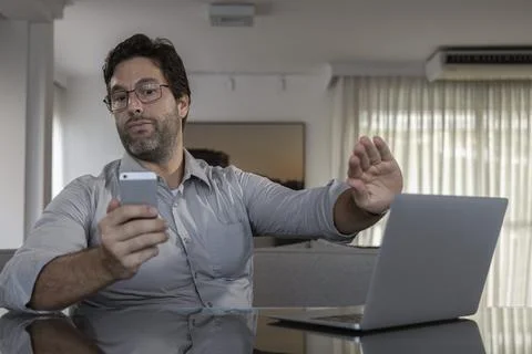 Brazilian man working at home Stock Photos