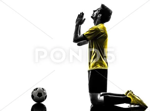 Brazilian soccer football player praying man Stock Photos
