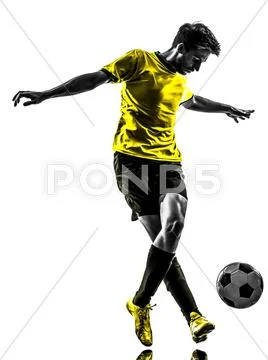 Brazilian soccer football player young man dribbling silhouette Stock Photos
