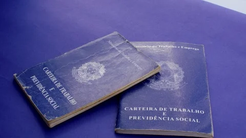Brazilian work permit on blue surface: professional emblem in stark contras.. Video stock 260823907
