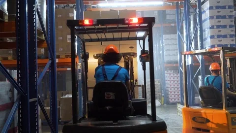 Breach of safety at a warehouse by a loader Stock Footage 99658274