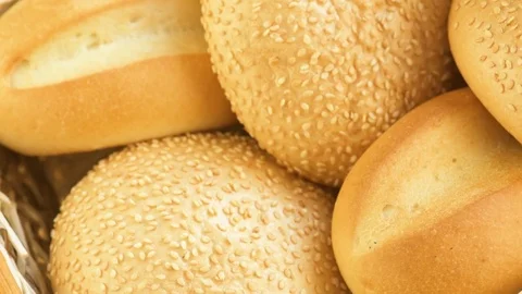 Bread and buns in baskets on shelf in bakery Stock Footage 73054868
