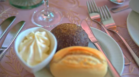 Bread and butter lie on the plate Stock Footage 65212838