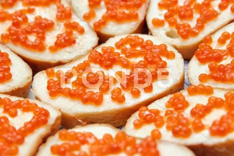 Bread and butter with red caviar. gourmet food Stock Photos