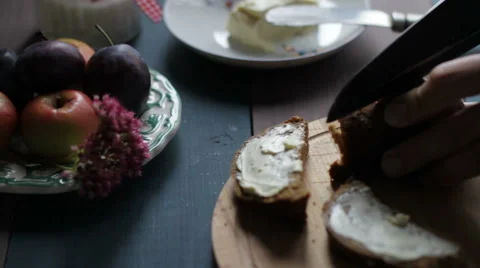Bread And Butter on wooden table, preparing Breakfast Stock-Footage 68907186
