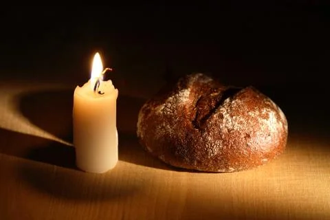 Bread and candle Stock Photos