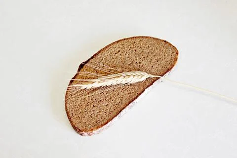Bread and ear on a white background Stock Photos