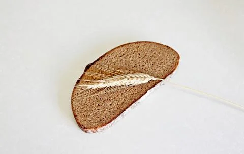 Bread and ear on a white background Stock Photos