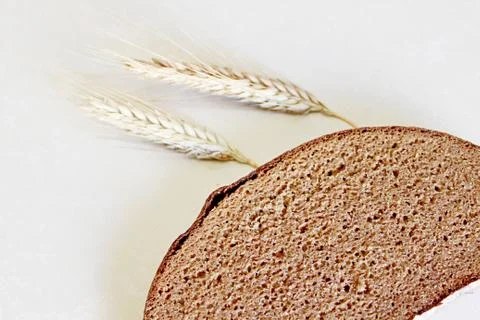 Bread and ear on a white background Stock Photos