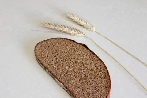 Bread and ear on a white background Stock Photos
