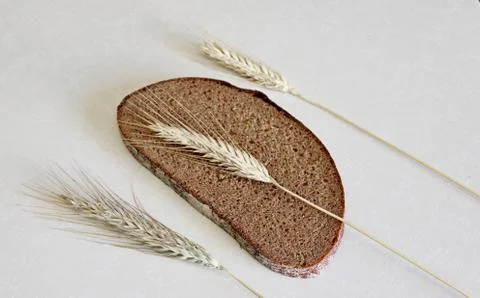 Bread and ear on a white background Stock Photos