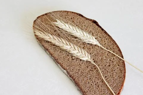 Bread and ear on a white background Stock Photos
