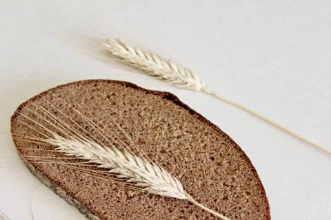 Bread and ear on a white background Stock Photos