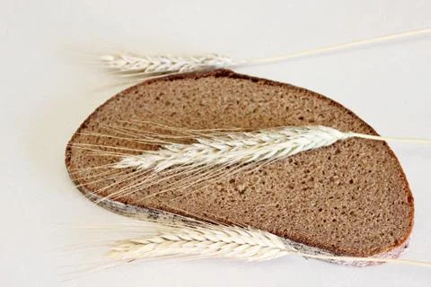 Bread and ear on a white background Stock Photos