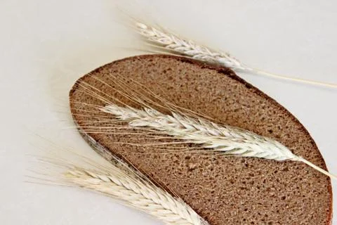 Bread and ear on a white background Stock Photos