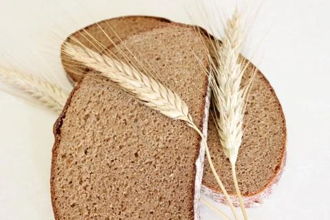 Bread and ear on a white background Stock Photos