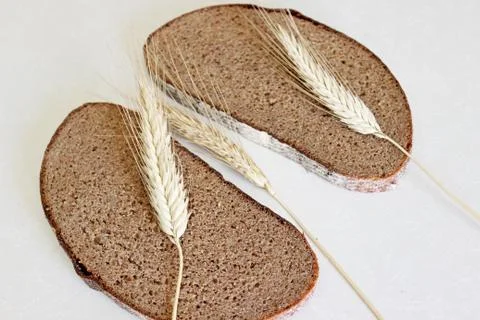 Bread and ear on a white background Stock Photos