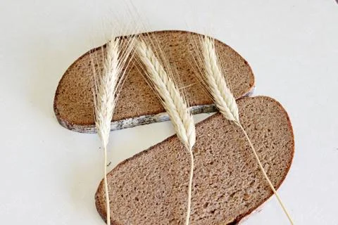 Bread and ear on a white background Stock Photos