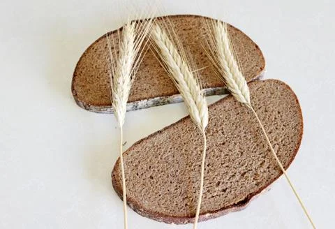 Bread and ear on a white background Stock Photos