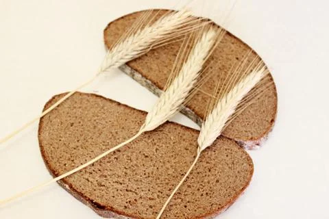 Bread and ear on a white background Stock Photos