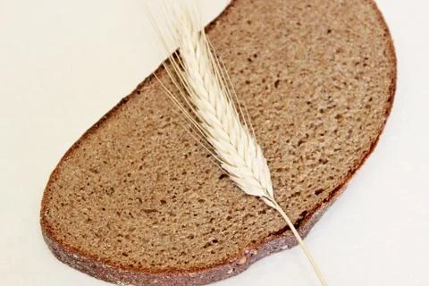 Bread and ear on a white background Stock Photos
