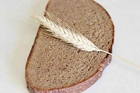 Bread and ear on a white background Stock Photos