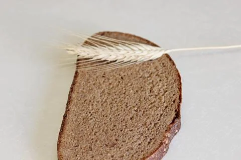 Bread and ear on a white background Stock Photos