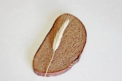 Bread and ear on a white background Stock Photos