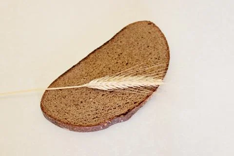 Bread and ear on a white background Stock Photos