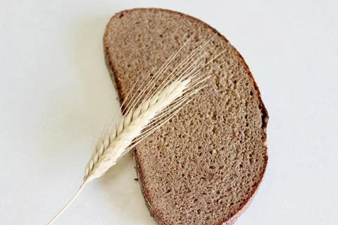 Bread and ear on a white background Stock Photos