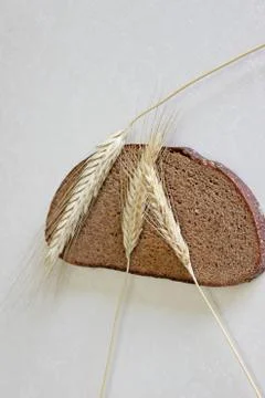 Bread and ear on a white background Stock Photos