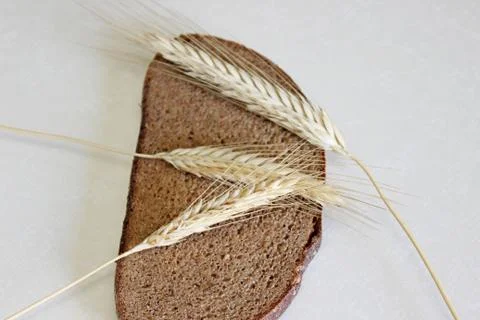 Bread and ear on a white background Stock Photos