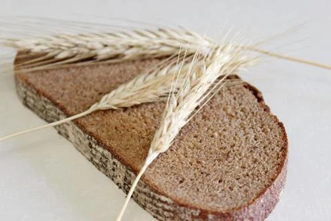 Bread and ear on a white background Stock Photos