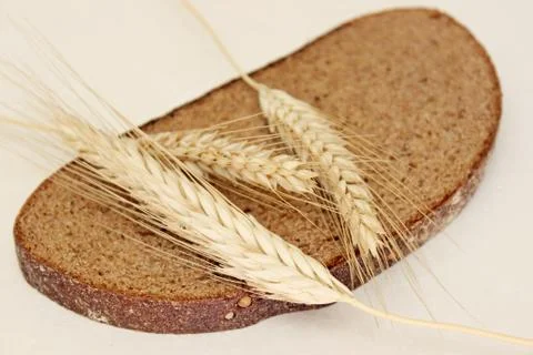 Bread and ear on a white background Stock Photos