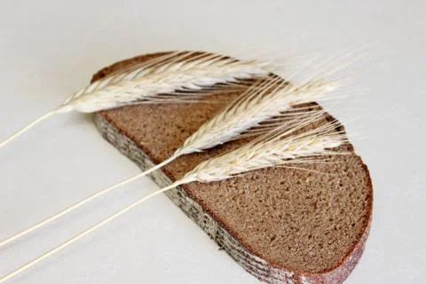 Bread and ear on a white background Stock Photos