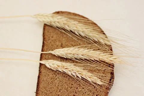 Bread and ear on a white background Stock Photos