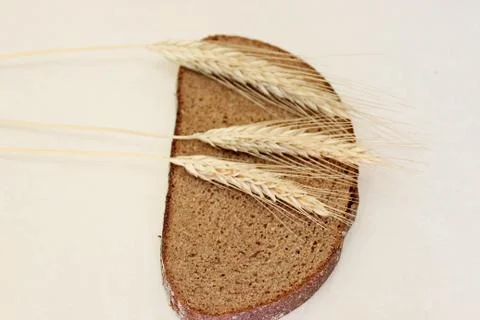 Bread and ear on a white background Stock Photos