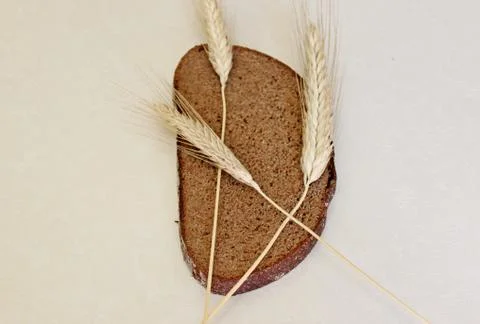 Bread and ear on a white background Stock Photos