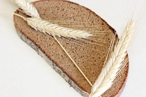 Bread and ear on a white background Stock Photos