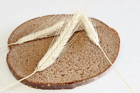 Bread and ear on a white background Stock Photos