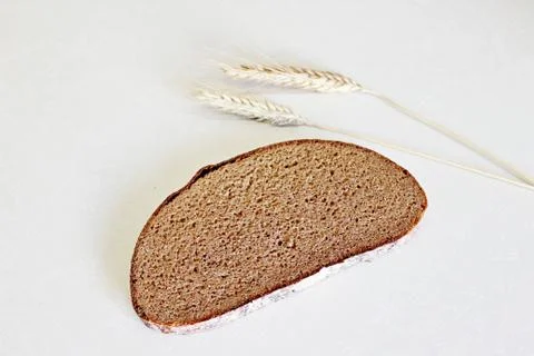 Bread and ear on a white background Stock Photos