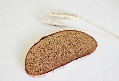 Bread and ear on a white background Stock Photos